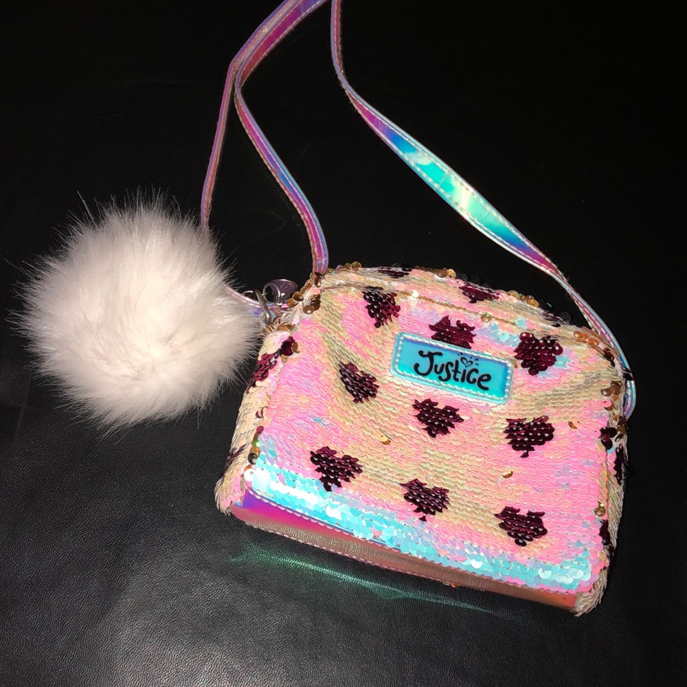 Justice purse. Has sequence on it. Gold and white